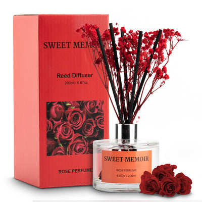 Sweet Memoir Rose Perfume Reed Diffuser with vibrant red reeds in a clear bottle, packaged in a bold red box with rose imagery.
