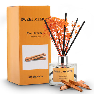 Sweet Memoir Sandalwood Reed Diffuser, 200ml bottle with black reeds and cinnamon-colored sandalwood sticks, in a complementary orange box.