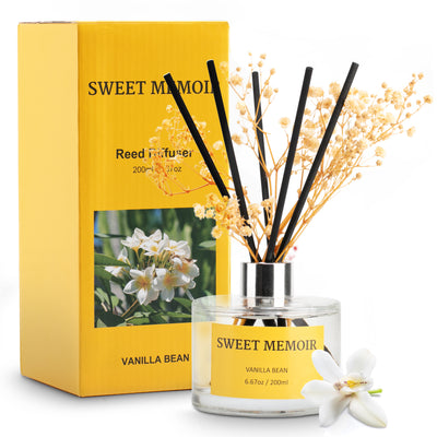 Sweet Memoir Vanilla Bean Dream Reed Diffuser in a clear bottle with vanilla flowers, presented in a vibrant yellow box.